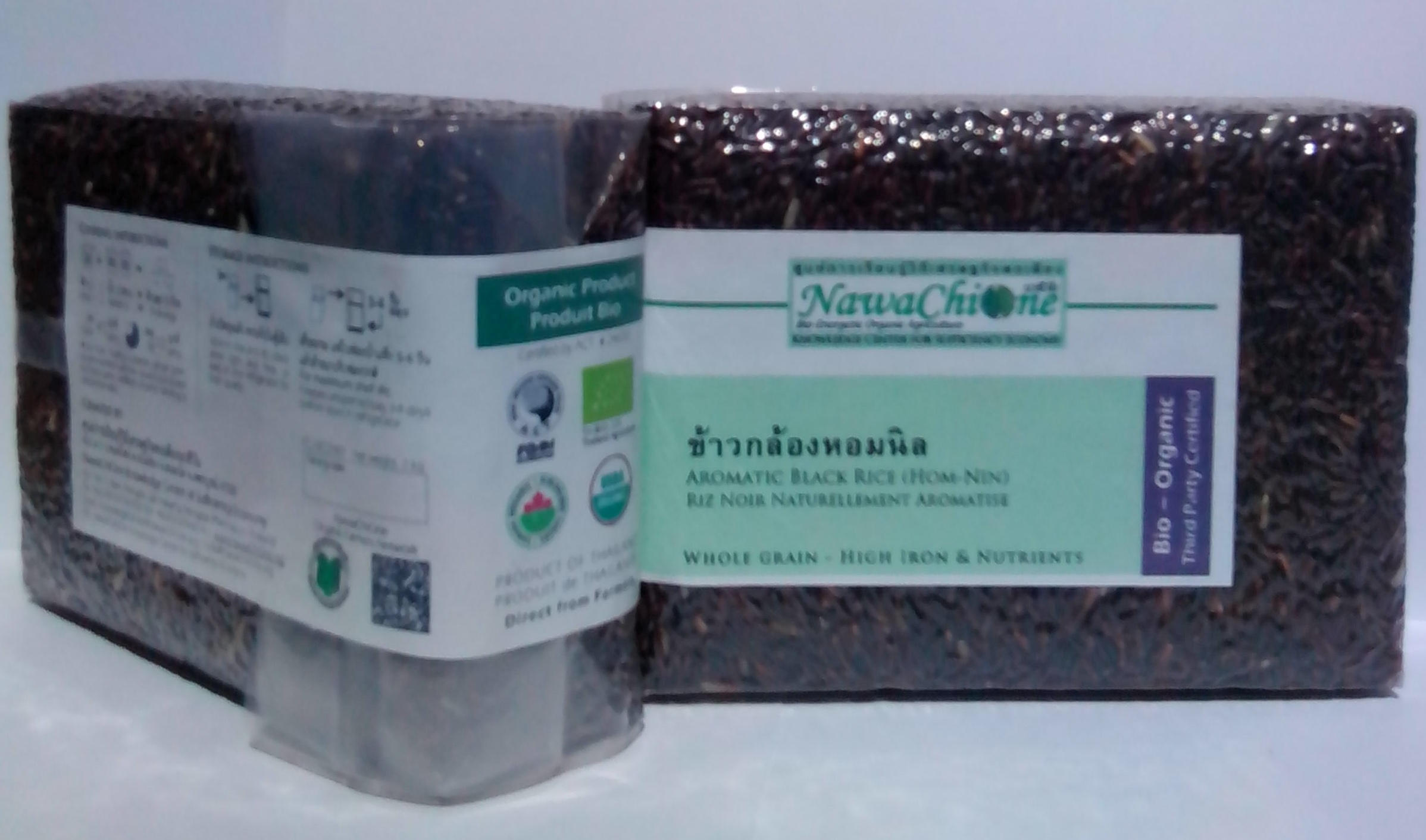 ข้าวกล้องหอมนิลอินทรีย์-นวชีวัน 
รับรองมาตราฐานเกษตรอินทรีย์ระดับสากล
Certified Organic Aromatic Black (Hom Nin) Rice
(IFOAM / EU / COR & NOP)
โดย ศูนย์การเรียนรู้วิถีเศรษฐกิจพอเพียงนวชีวัน